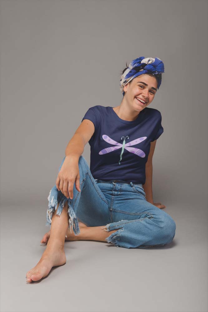 young-girl-wearing-a-t-shirt-mockup-sitting-on-a-photo-studio-a20884